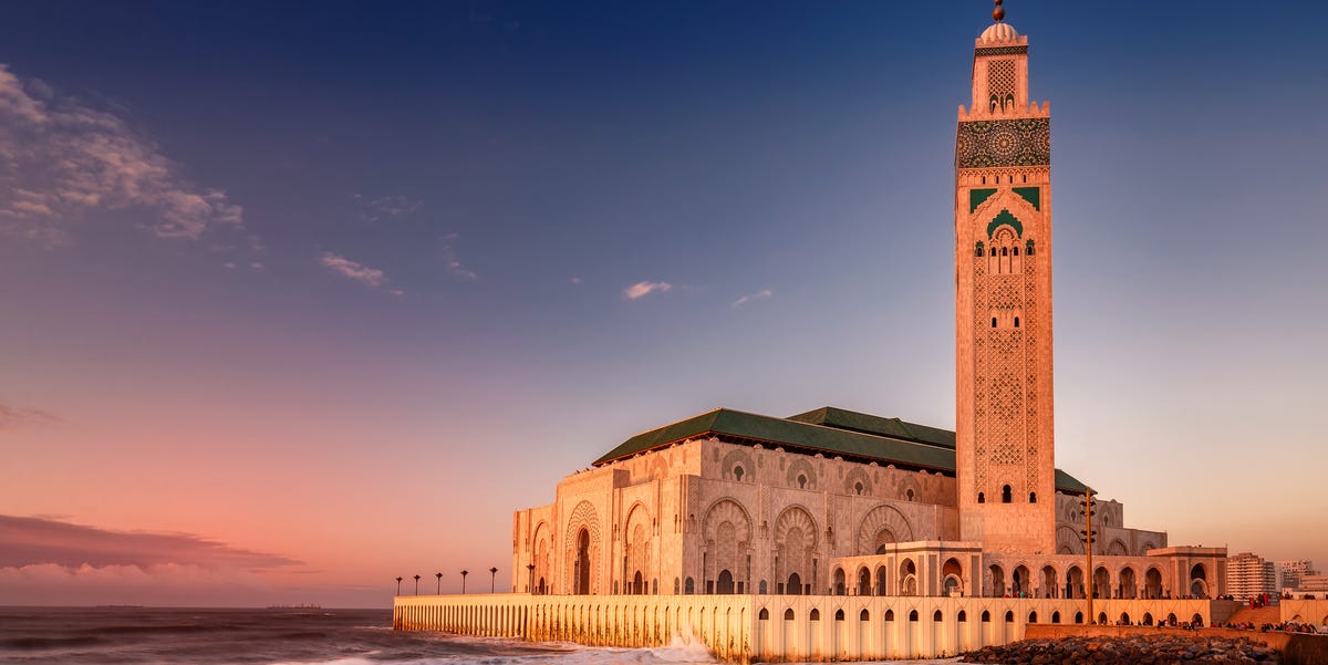 Hassan II Mosque and Casablanca skyline at golden hour
