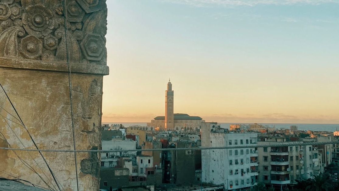 Casablanca skyline at golden hour with Hassan II Mosque